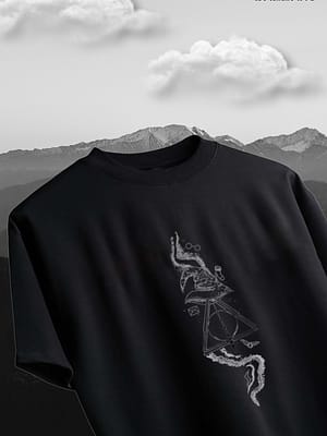 Black T-shirt featuring a graphic design of abstract shapes and lines on the front.